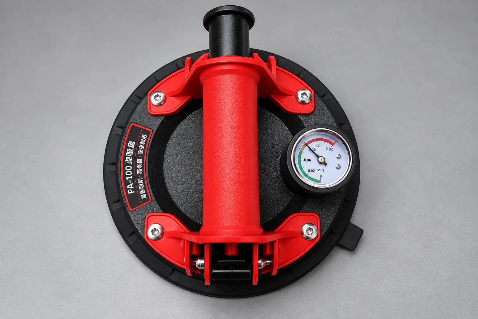 Red and black air vacuum suction cup with pressure gauge, top view