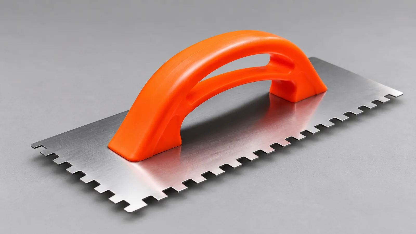 Square-notch steel trowel with an orange handle